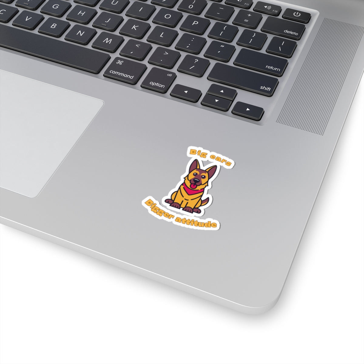 Kiss-cut sticker with German Shepherd graphic and big ears bigger attitude slogan applied to laptop surface