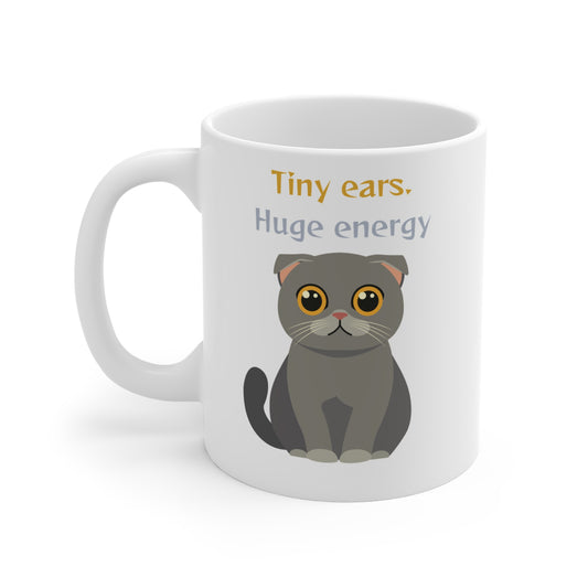 White coffee mug with Scottish Fold cat graphic and tiny ears huge energy slogan shown from right side