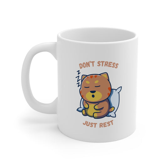 White coffee mug with sleepy cat graphic and don’t stress just rest slogan left side