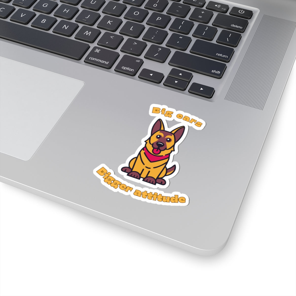 Kiss-cut sticker with German Shepherd graphic and big ears bigger attitude slogan applied to laptop surface