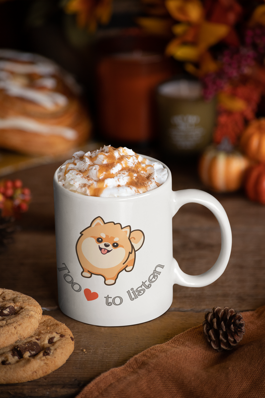 11 oz white coffee mug with pomeranian graphic and too cute to listen slogan surrounded by Thanksgiving decorations