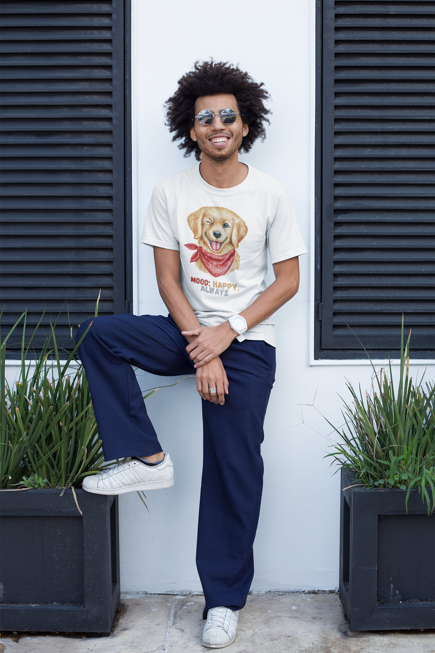 Smiling man with afro and sunglasses wearing a white t shirt with labrador retriever graphic and mood happy always slogan