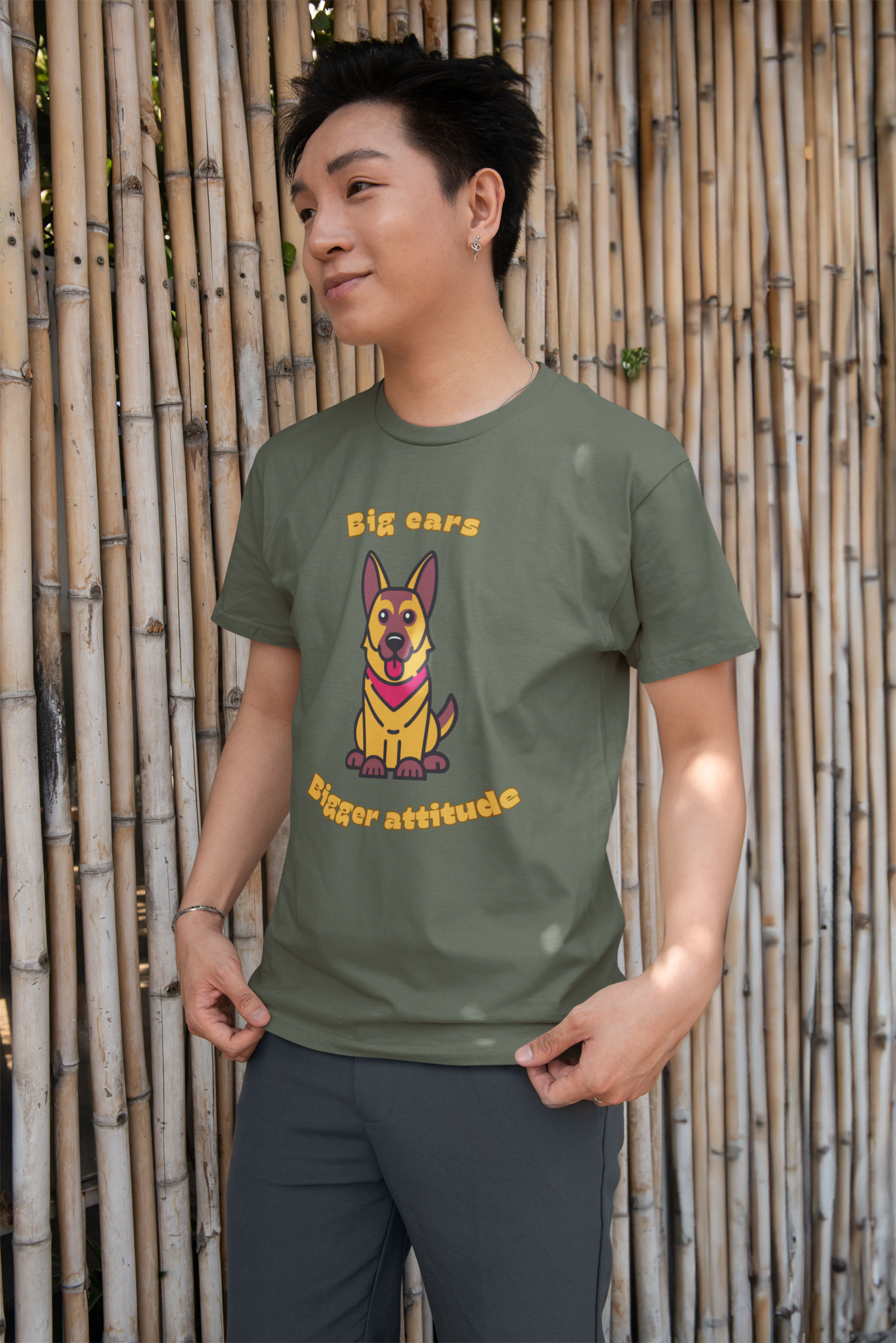 Smiling man wearing army green round neck Bella Canvas t shirt with German Shepherd graphic and big ears bigger attitude slogan