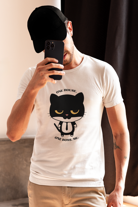 Bearded man with tattoos taking a selfie wearing white t-shirt with black cat graphic in tie and one house one boss me slogan